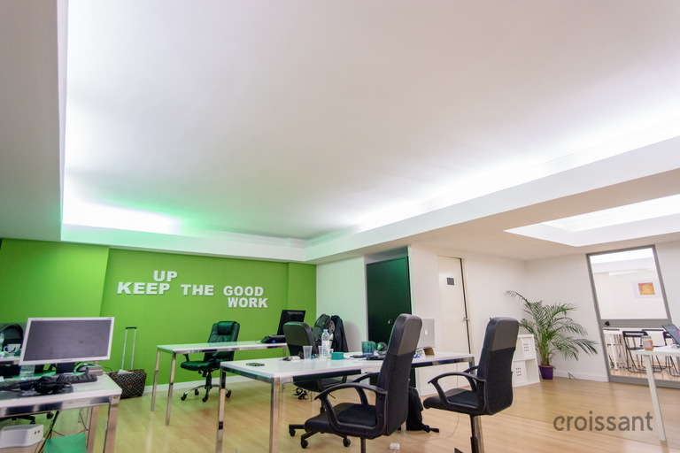 a living room filled with furniture and a tv