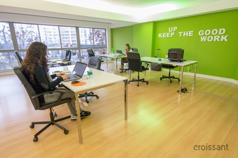 a living room filled with furniture on top of a hard wood floor