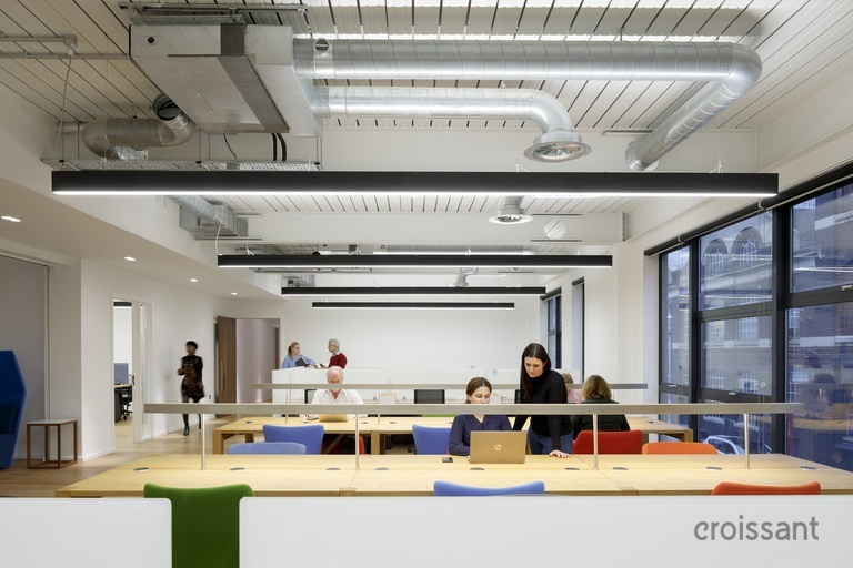 a person sitting at a table in a room