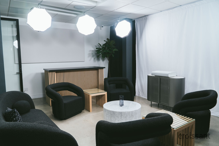 a living room filled with furniture and a table
