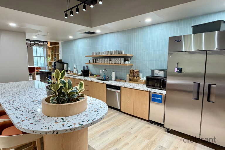 a kitchen with an island in the middle of a room