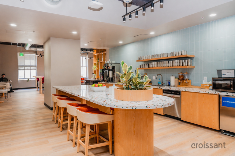 a kitchen with a countertop and stools