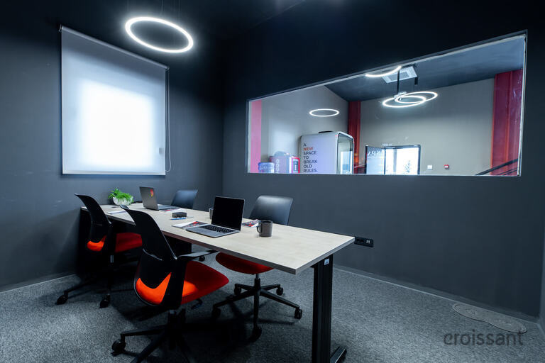 a person sitting at a table in a room