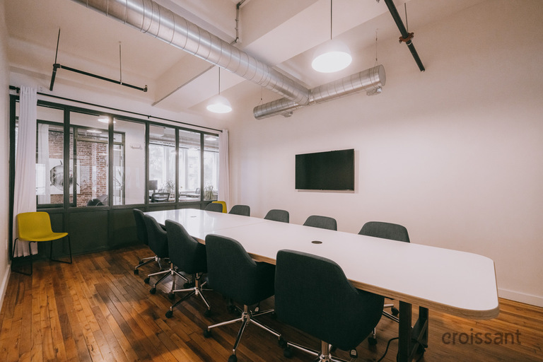 a living room filled with furniture and a wood floor