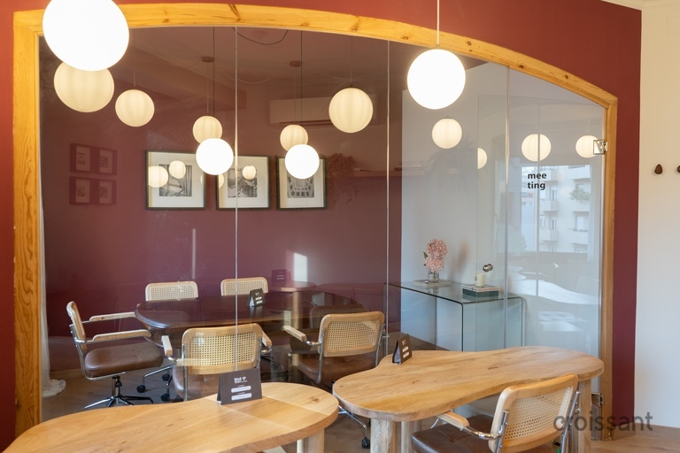 a dining room table in front of a mirror