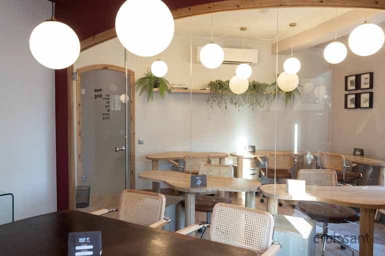 a dining room table in front of a mirror
