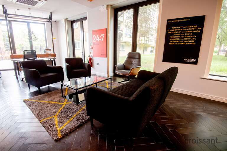 a living room filled with furniture and a fire place