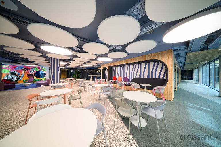 a bedroom with a bed and chair