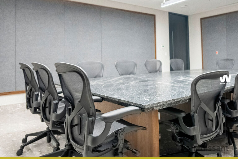 an office with a desk and chair in a room
