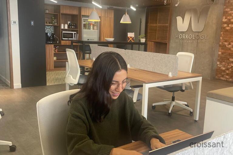 a person sitting at a table in a room