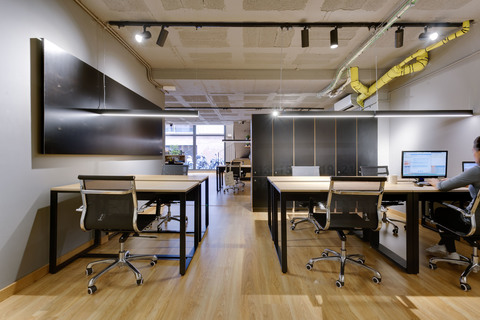 a room filled with furniture and a wood floor