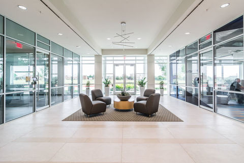 a room filled with furniture and a large window