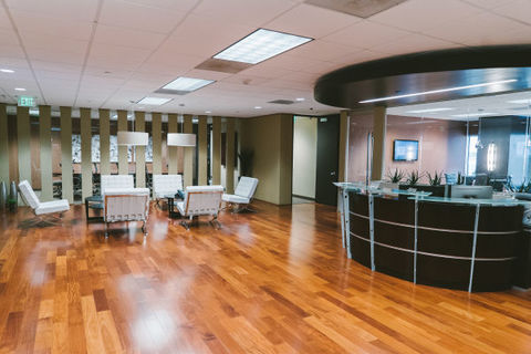 a room filled with furniture on top of a hard wood floor