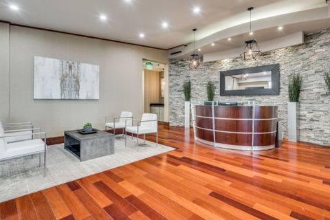 a view of a living room with a wood floor