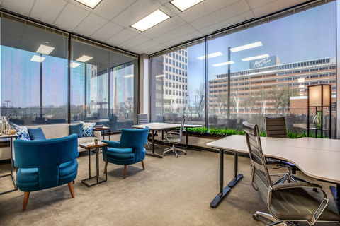 a room filled with furniture and a blue chair