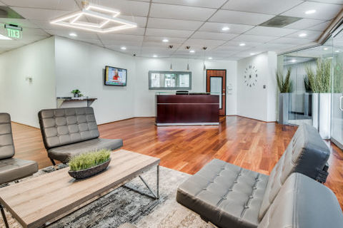 a living room filled with furniture and a flat screen tv