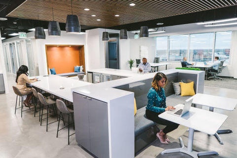 a person sitting at a desk in a room