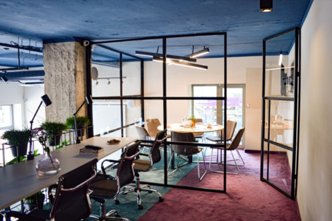 a dining room table in front of a window