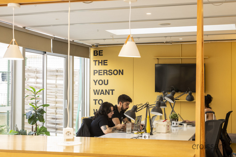 a group of people sitting at a table in a room