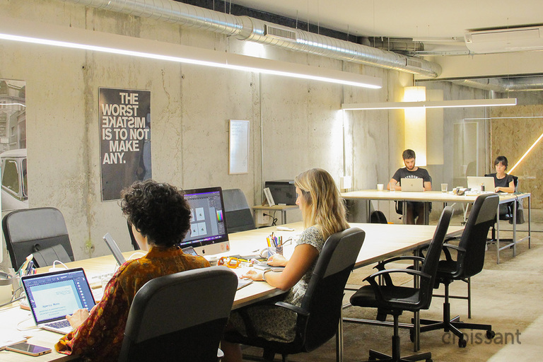 a group of people sitting at a desk
