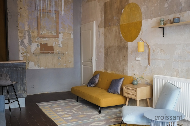 a living room filled with furniture and a fireplace